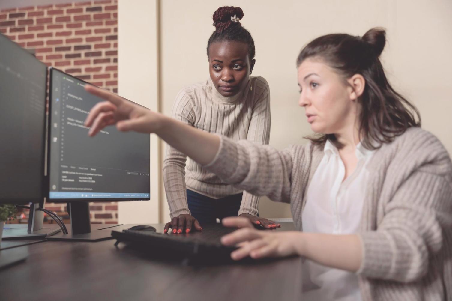 Software development team collaborating on testing strategies